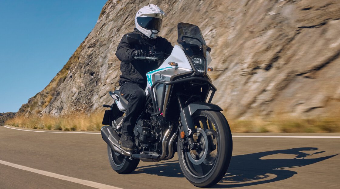 NX500 rider on a coastal road